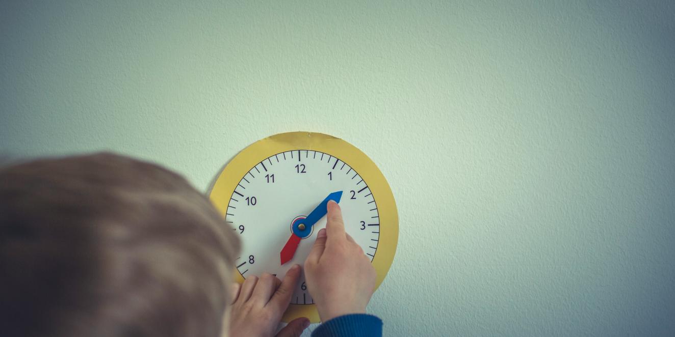 child with clock